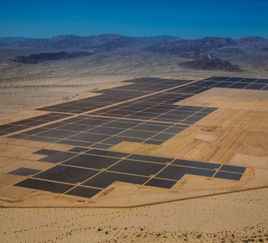 Solar panels are seen in this aerial photograph of First Solar Inc.'s Desert Sunlight Solar Farm in Mojave Desert, California, U.S., on Friday, April 5, 2013. First Solar Inc., the largest thin-film panel manufacturer, sees “significant growth” in renewable energy projects being developed in the Middle East and North Africa by the end of 2014. Photographer: Tim Rue/Bloomberg