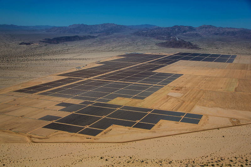 Solar panels are seen in this aerial photograph of First Solar Inc.'s Desert Sunlight Solar Farm in Mojave Desert, California, U.S., on Friday, April 5, 2013. First Solar Inc., the largest thin-film panel manufacturer, sees “significant growth” in renewable energy projects being developed in the Middle East and North Africa by the end of 2014. Photographer: Tim Rue/Bloomberg
